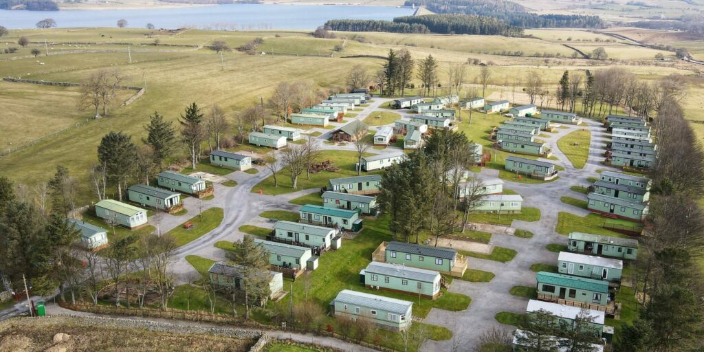 Village green holiday park surrounded by fields