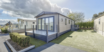 2020 ABI Ambleside Modern caravan with landscaped surroundings.