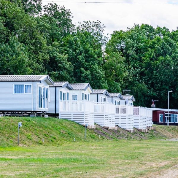 Row of white holiday cabins
