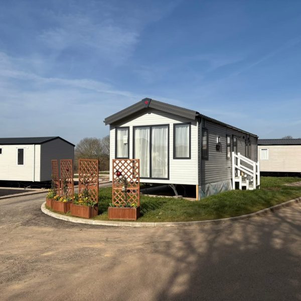 Modern static caravan in peaceful setting