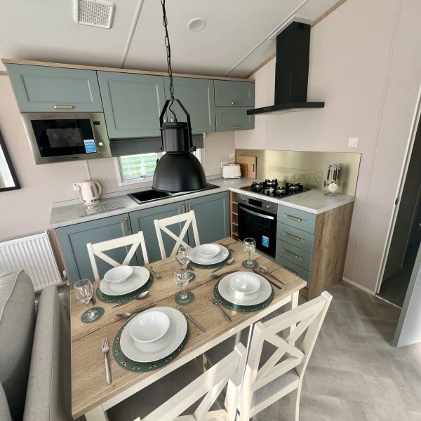 Modern kitchen with dining table set.