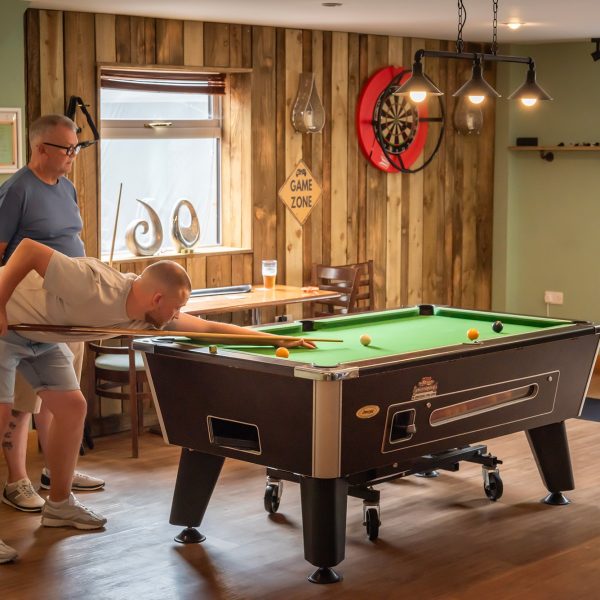 Two men playing pool in pub.