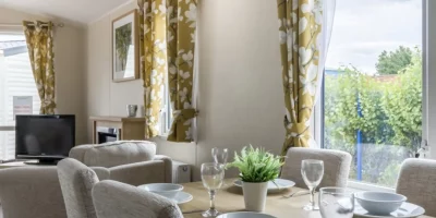 Bright dining area with floral curtains