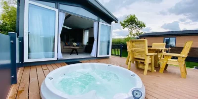 Hot tub on wooden deck terrace.